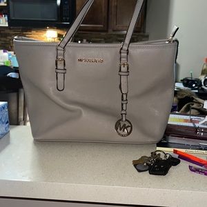 Gray leather Micheal kors bag.